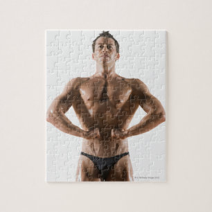 Verbuiging en pooiing van mannelijke lichaamsbouwe legpuzzel