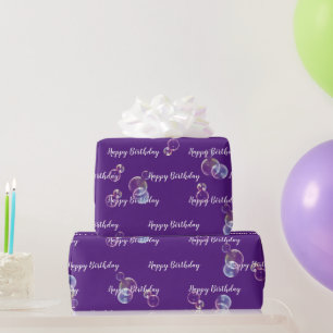 Verjaardagszeepbellen op paars cadeaupapier