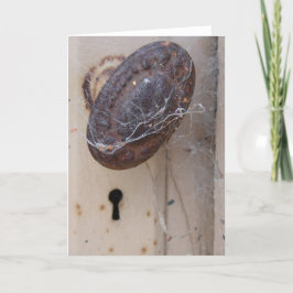 Verlaten deur met spinnenweb kaart