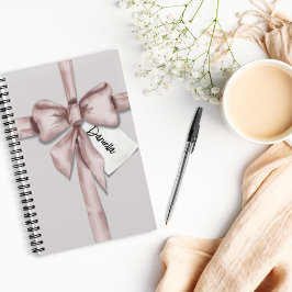 Verpakt in een roze strik notitieboek