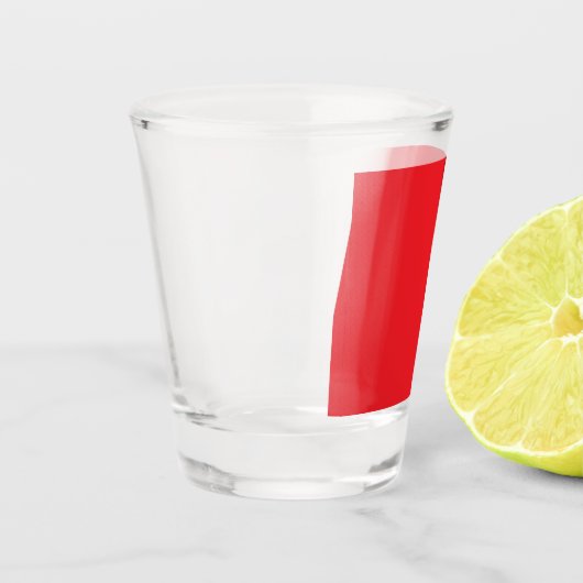 Verre A Shot un arrière - plan rouge avec une bordure blanche (Gauche)