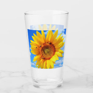 Verre Tournesol jaune et abeilles sur le ciel bleu