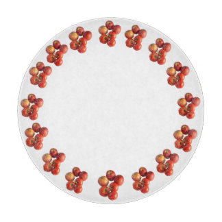 Verse appels en tomaten ronde glazen snijplank