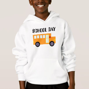 Veste mignonne d'enfant de jour d'école d'autobus