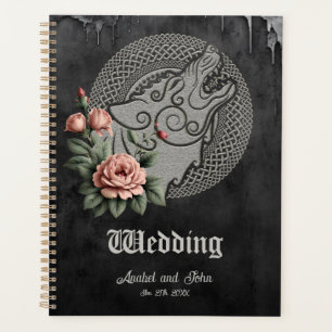 Viking Wolf & Rose. Une tête de loup stylisée,