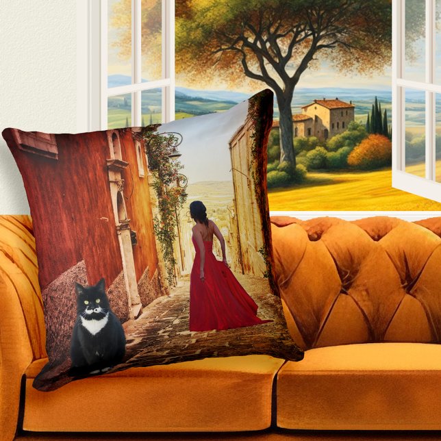 Village italien romantique Coussin d'art (Pillow featuring a painting of a lady in red in a romantic Italian village with a big tuxedo cat)