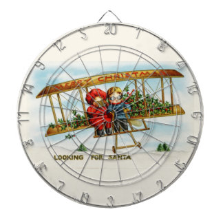 Vintage kerstkinderen die op zoek zijn naar de ker dartbord