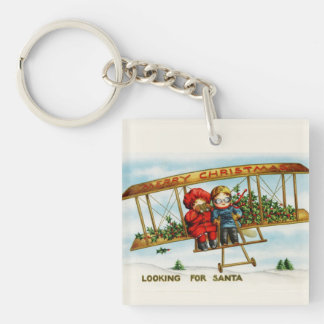 Vintage kerstkinderen die op zoek zijn naar de ker sleutelhanger