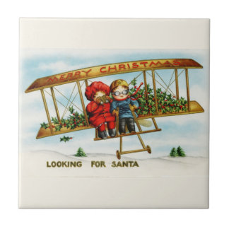 Vintage kerstkinderen die op zoek zijn naar de ker tegeltje