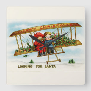 Vintage kerstkinderen die op zoek zijn naar de ker vierkante klok