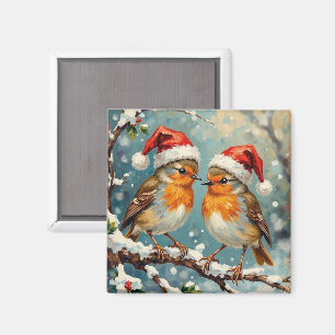 Vintage roodborstjes met kerstmutsen op besneeuwde magneet