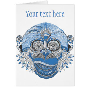 Visage bleu de singe avec le motif et les plumes