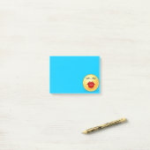 Visage qui Embaie sur un Post-It Bleu (Sur un bureau)