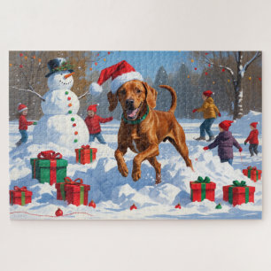Vizsla hardlopend in de sneeuw met kerstmuts legpuzzel