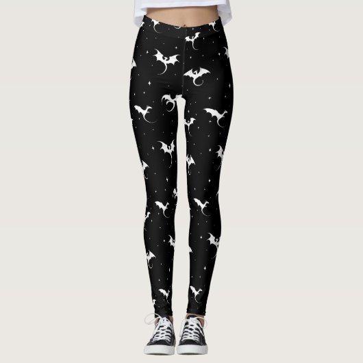 Vliegende draken en sterren op zwarte achtergrond leggings (Voorkant)