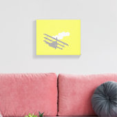 Vliegtuig op effen gele achtergrond. canvas afdruk (Insitu (Woonkamer))