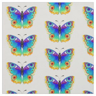 Vlinder met pauwenogen in regenboogkleuren stof