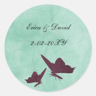  vlinders van de soort aqua en plum omhullen de ze ronde sticker