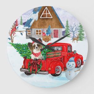Vlindervlindhond in kerstbezorgingswagen sneeuw grote klok