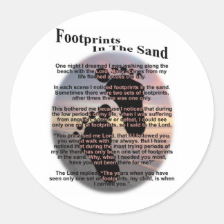 Voetafdrukken in de zand ronde sticker