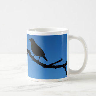 Vogel op een filiaal koffiemok