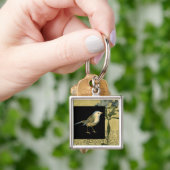 Vogel op zwarte en achtergrond sleutelhanger (Hand)