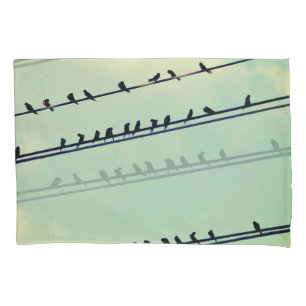 Vogels op draden, blauwe lucht. kussensloop