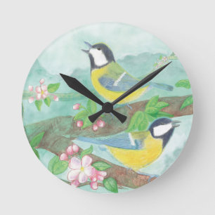 Vogels zingen op een bloeiende boomtak ronde klok