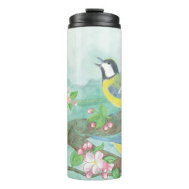 Vogels zingen op een bloeiende boomtak thermosbeker