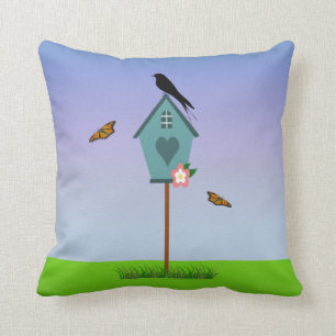  vogelsilhouet op een blauw vogelhuis kussen