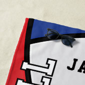 Volleybal in rood, wit en blauw strandlaken (In situ)