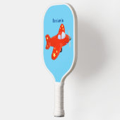 Voorbeeld van de cartoon van het rode luchtvliegtu pickleball paddle (Links)