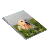 Votre chiot mignon sur un carnet de notes à (Côté Droit)