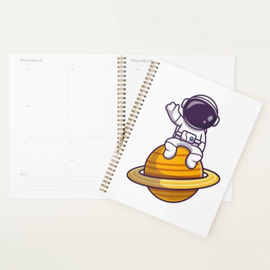 Vriendelijke astronaut zwaait van een planeet planner (Display)