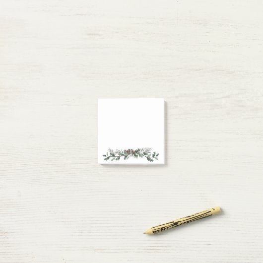 Vroege kerstgroet mistletoe en dennenpoep post-it® notes (Op bureau)