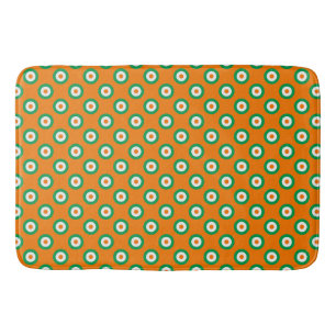 Vrolijke groene/witte/oranje stippen op oranje badmat
