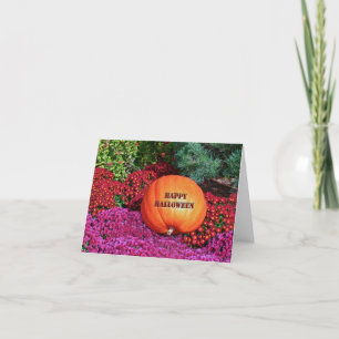 "VROLIJKE HALLOWEEN POMPOEN TUSSEN BLOEMEN" KAART