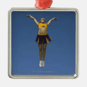 Vrouw cheerleader springt in de lucht , voorste ui metalen ornament