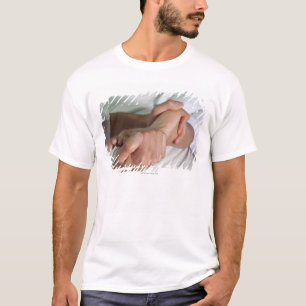 Vrouw met voetmassage 2 t-shirt
