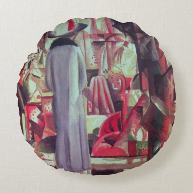 Vrouw voor een groot verlicht raam rond kussen (Voorkant)