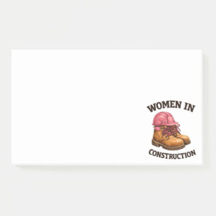Vrouwen in de bouw met werkschoenen en veiligheids post-it® notes