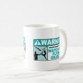 Waarschuwing: let op vliegende objecten! koffiemok (Voorkant rechts)