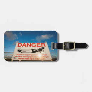 waarschuwingsbord nabij de luchthaven van Sint Maa Bagagelabel