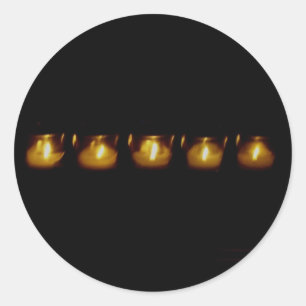 Warmte in de duisternis ronde sticker