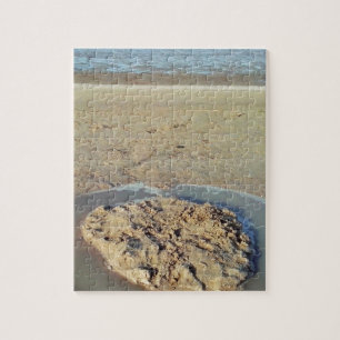 Watercirkel in zand op strand, zomertijd legpuzzel