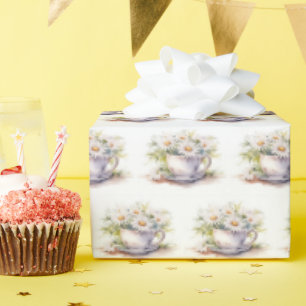 Waterverf madeliefjes in koffiekopje met schotel cadeaupapier