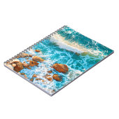 Waves op een rotzand bij zonsondergang. Luchtvaart Notitieboek (Linkerzijde)