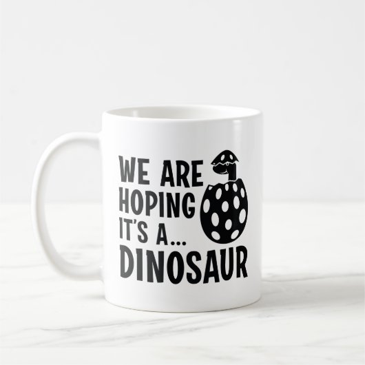 We hopen dat het een dinosaurus is koffiemok (Links)