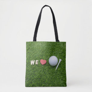 We houden van golf met golfbal en t-shirt op groen draagtas