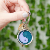 Weegschaal en wateros sleutelhanger (Hand)